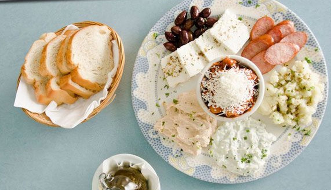 Appetizer platter with bread, feta and dips